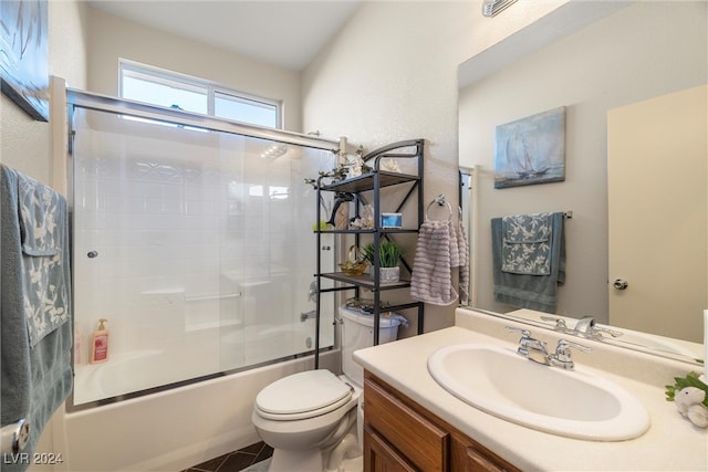 full bathroom featuring tile patterned flooring, vanity, toilet, and enclosed tub / shower combo