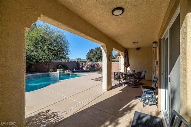 view of pool featuring a patio area