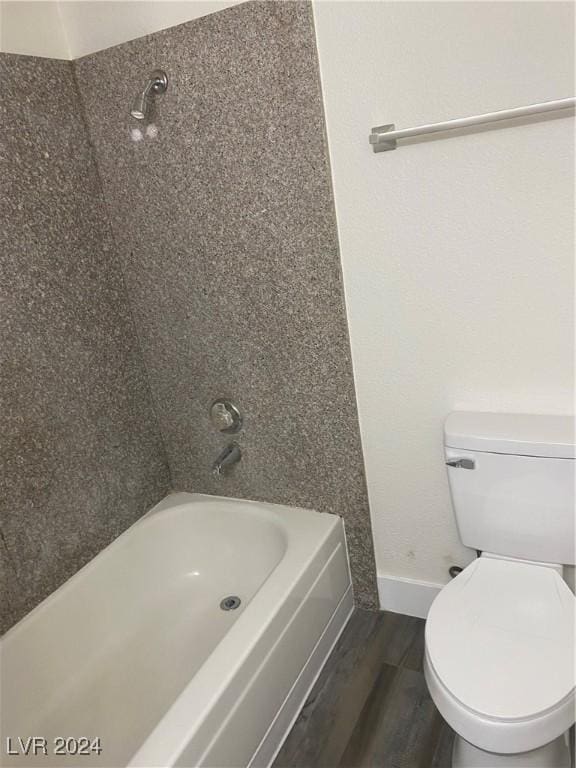 5317 Indian River Dr Unit 295, Las Vegas, NV 89103 - bathroom featuring wood finished floors, toilet, baseboards, and tub / shower combination
