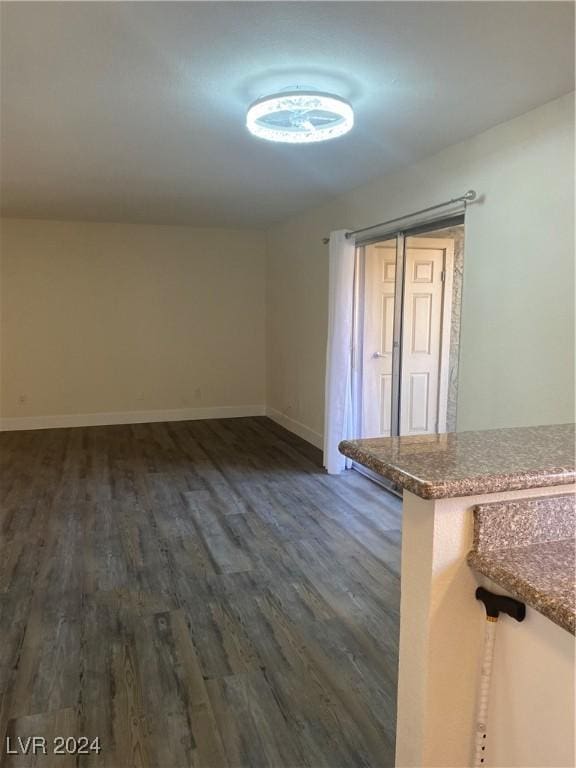 5317 Indian River Dr Unit 295, Las Vegas, NV 89103 - empty room with dark wood-style floors and baseboards