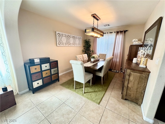 dining area with light tile patterned floors