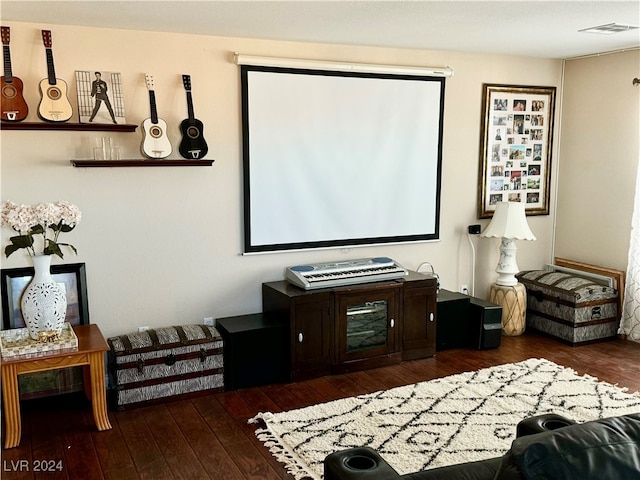 home theater room featuring dark hardwood / wood-style floors