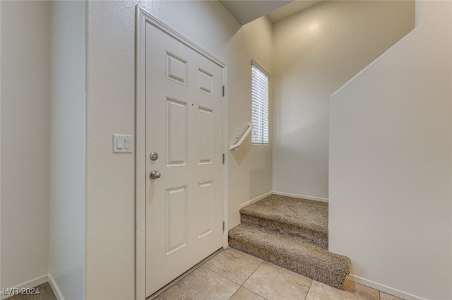 foyer with light tile patterned flooring