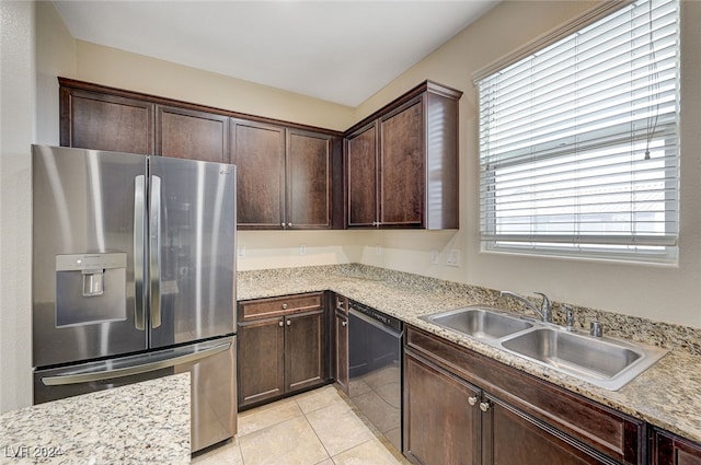 kitchen featuring stainless steel fridge, dishwasher, a healthy amount of sunlight, and sink