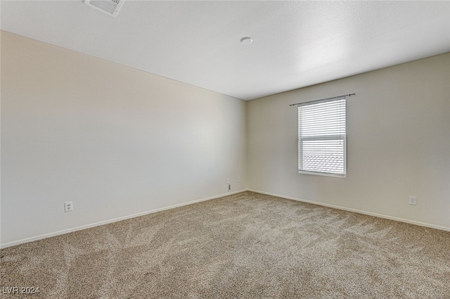 empty room with carpet flooring