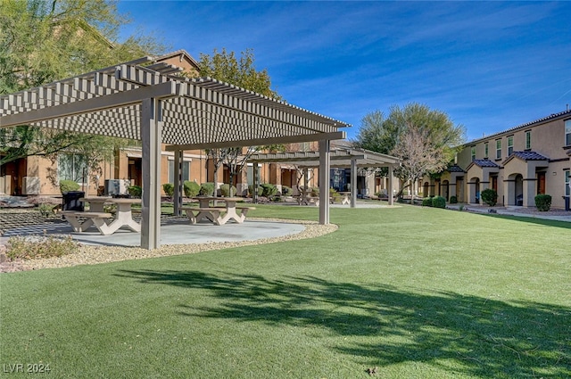 surrounding community featuring a yard, a pergola, and a patio area