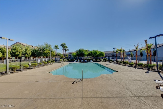 view of swimming pool with a patio area