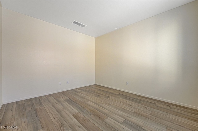 spare room featuring light wood-type flooring