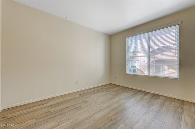 unfurnished room featuring light wood-type flooring