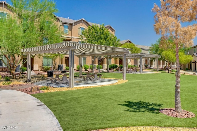 view of property's community with a lawn and a pergola