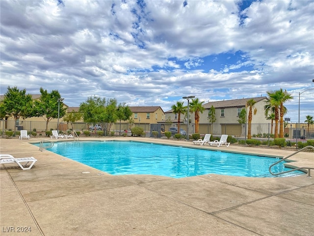 view of swimming pool with a patio