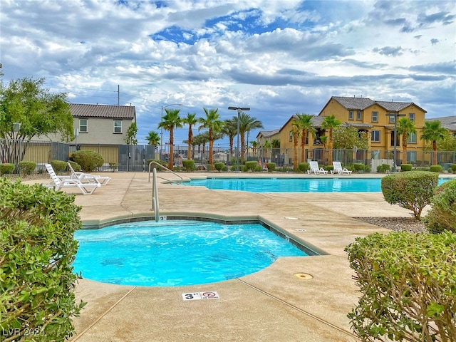 view of swimming pool with a patio area