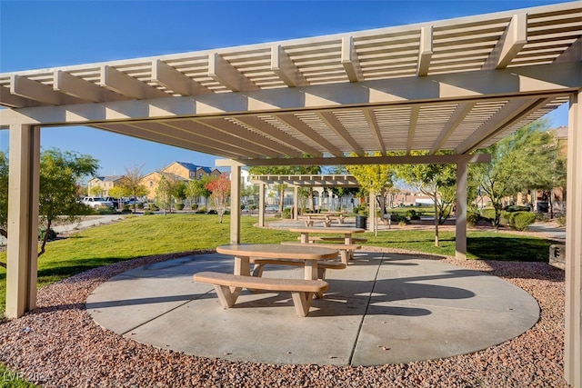 view of home's community featuring a pergola, a patio area, and a yard