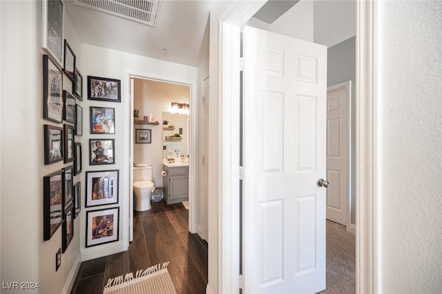 hallway with dark hardwood / wood-style floors