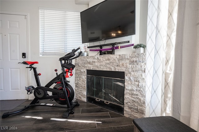 exercise room featuring a fireplace