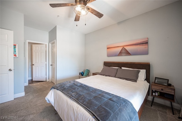 bedroom with dark colored carpet and ceiling fan