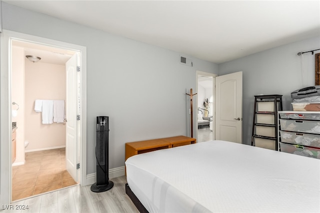 bedroom featuring light wood-type flooring