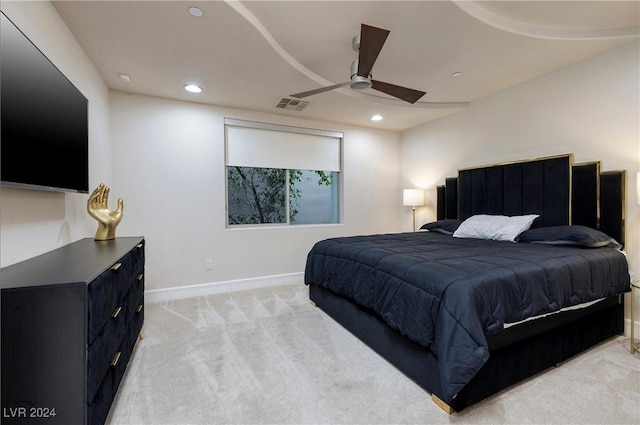 bedroom with light colored carpet and ceiling fan