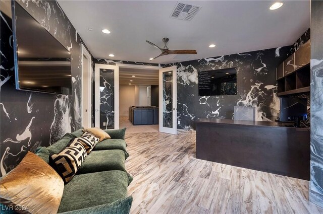 interior space featuring wood-type flooring and ceiling fan