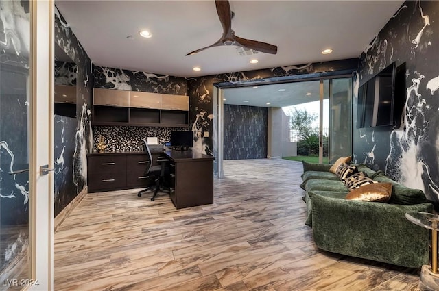 office area featuring built in desk and ceiling fan