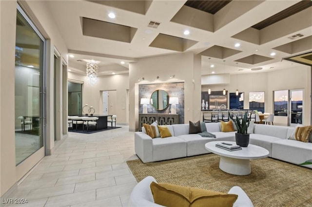 living room with coffered ceiling and a high ceiling