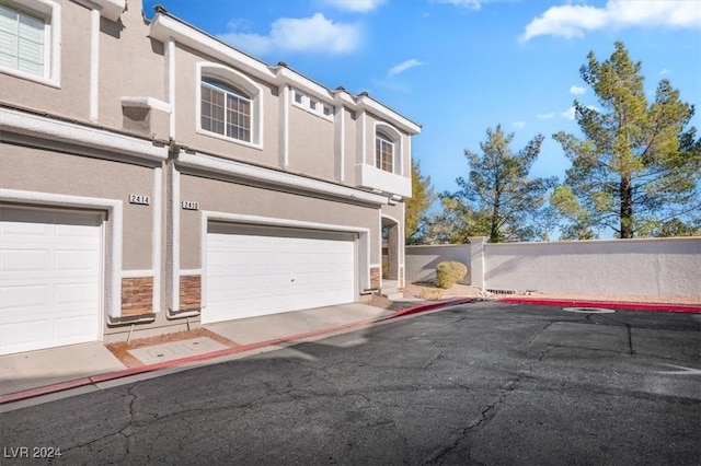 view of side of home featuring a garage