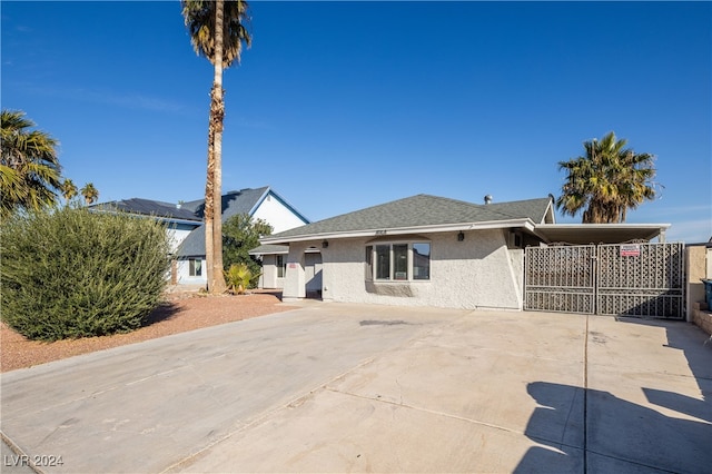 back of property featuring a carport