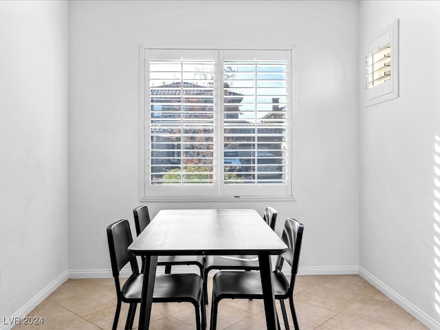 tiled dining area featuring plenty of natural light