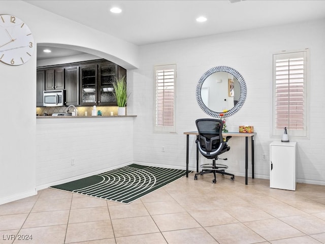 office area with tile patterned flooring and a healthy amount of sunlight