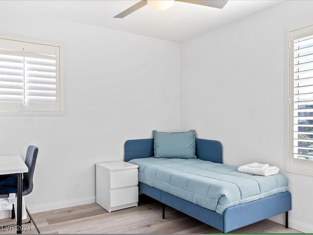 interior space with ceiling fan and light wood-type flooring