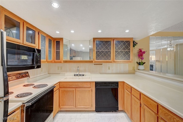 kitchen with ceiling fan, sink, and black appliances