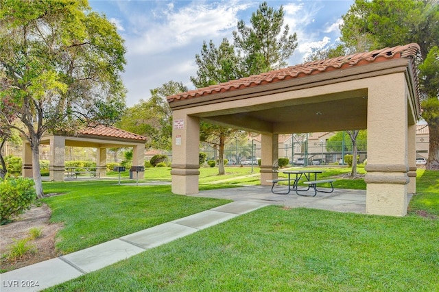 view of home's community with a gazebo and a yard