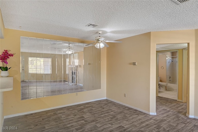 unfurnished room featuring hardwood / wood-style floors, a textured ceiling, and ceiling fan