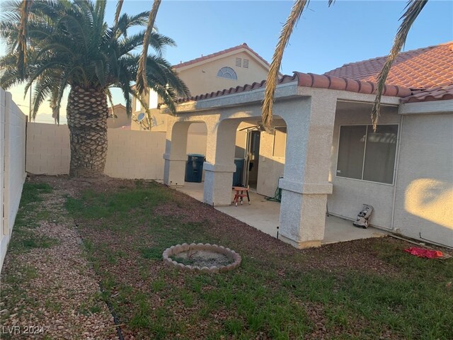 view of side of property featuring a patio