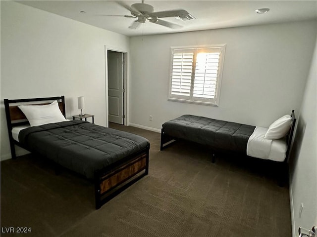 carpeted bedroom with ceiling fan, visible vents, and baseboards