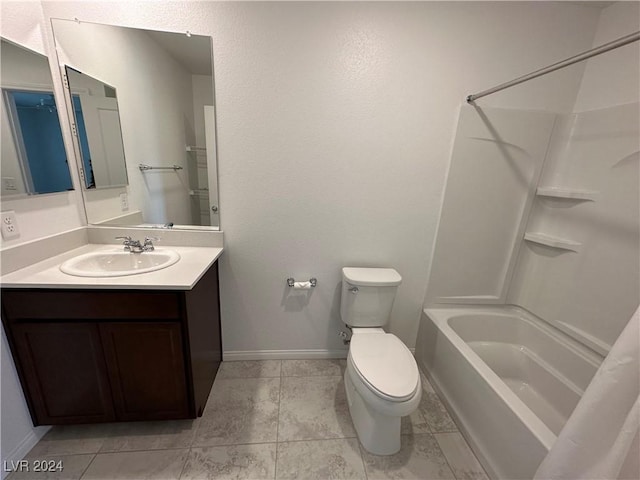 full bath featuring washtub / shower combination, vanity, toilet, and baseboards