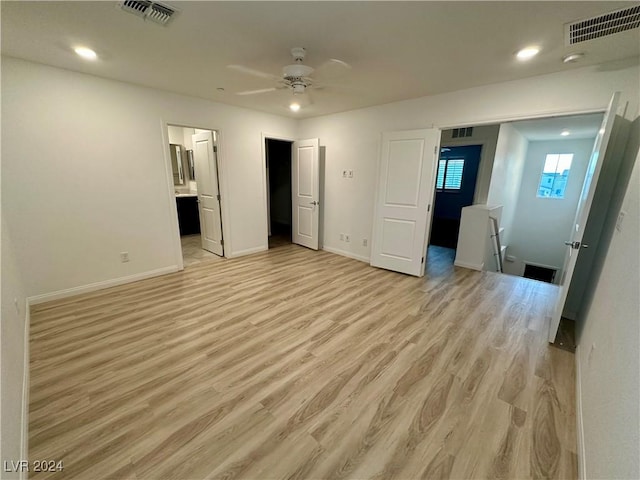 unfurnished bedroom featuring light wood-type flooring, visible vents, baseboards, and recessed lighting