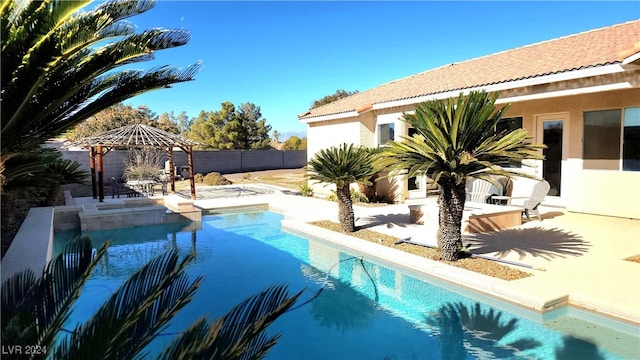 view of pool with a gazebo and a patio area