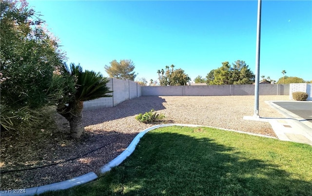 view of yard with a fenced backyard