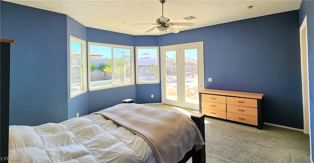 bedroom featuring visible vents, baseboards, light colored carpet, ceiling fan, and access to exterior