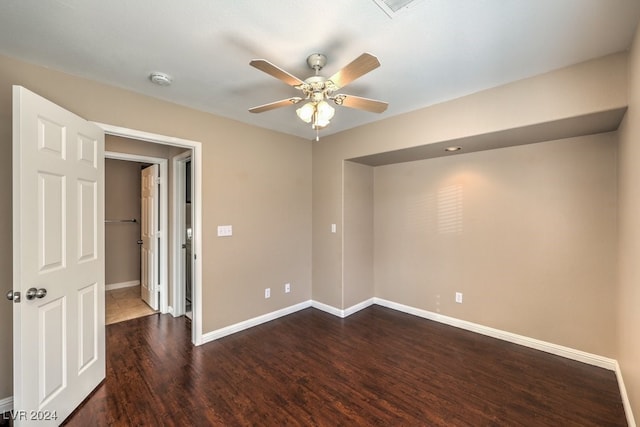 unfurnished room featuring ceiling fan and dark hardwood / wood-style floors