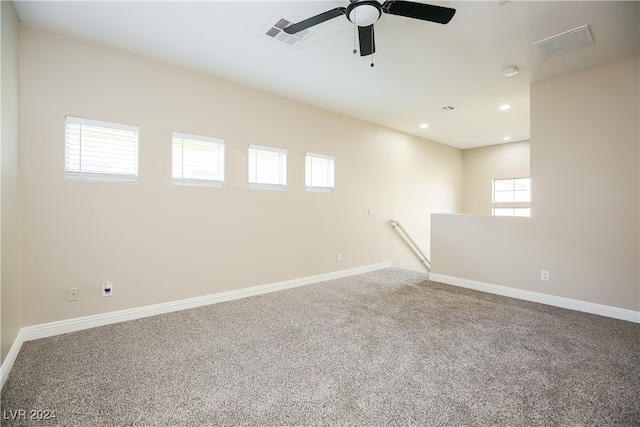 empty room featuring carpet floors and ceiling fan