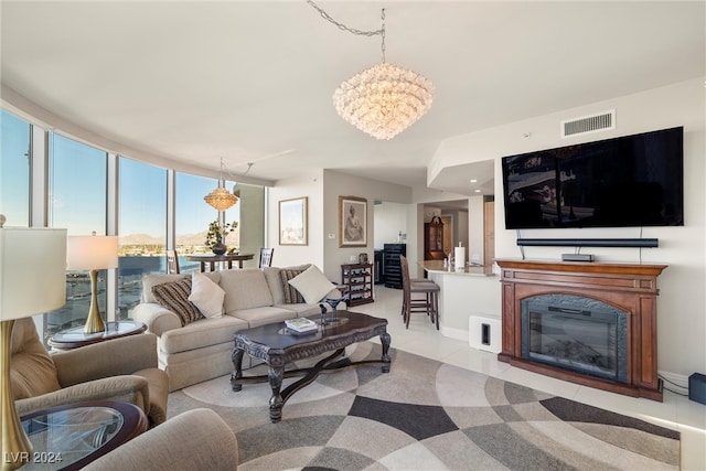 tiled living room with a chandelier