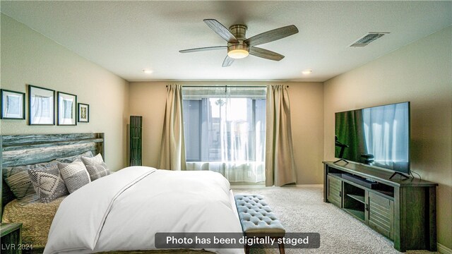 carpeted bedroom featuring ceiling fan