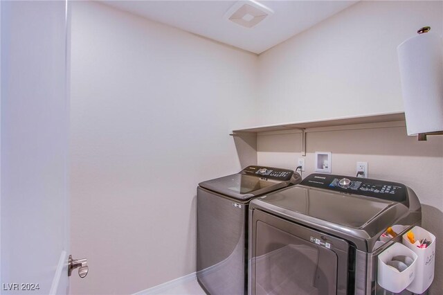 laundry area featuring washing machine and clothes dryer