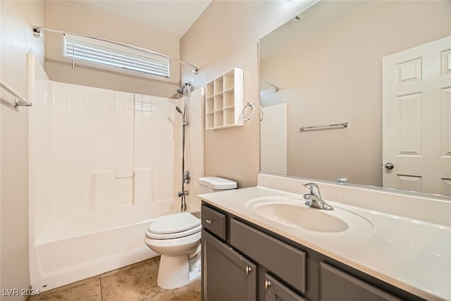 full bathroom featuring tile patterned floors, vanity, toilet, and shower / washtub combination