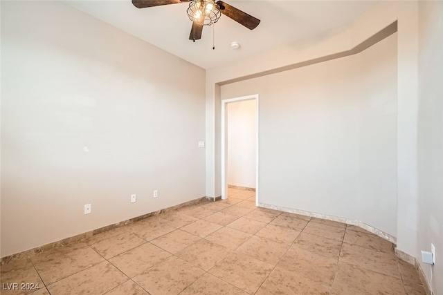 unfurnished room with ceiling fan