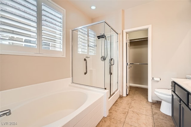 full bathroom featuring separate shower and tub, vanity, a healthy amount of sunlight, and toilet