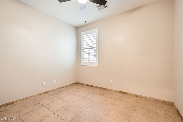 spare room with ceiling fan