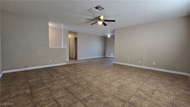 spare room featuring ceiling fan and a textured ceiling